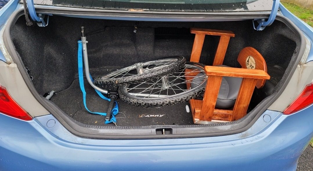 The Economy Sulky taken apart in a car trunk