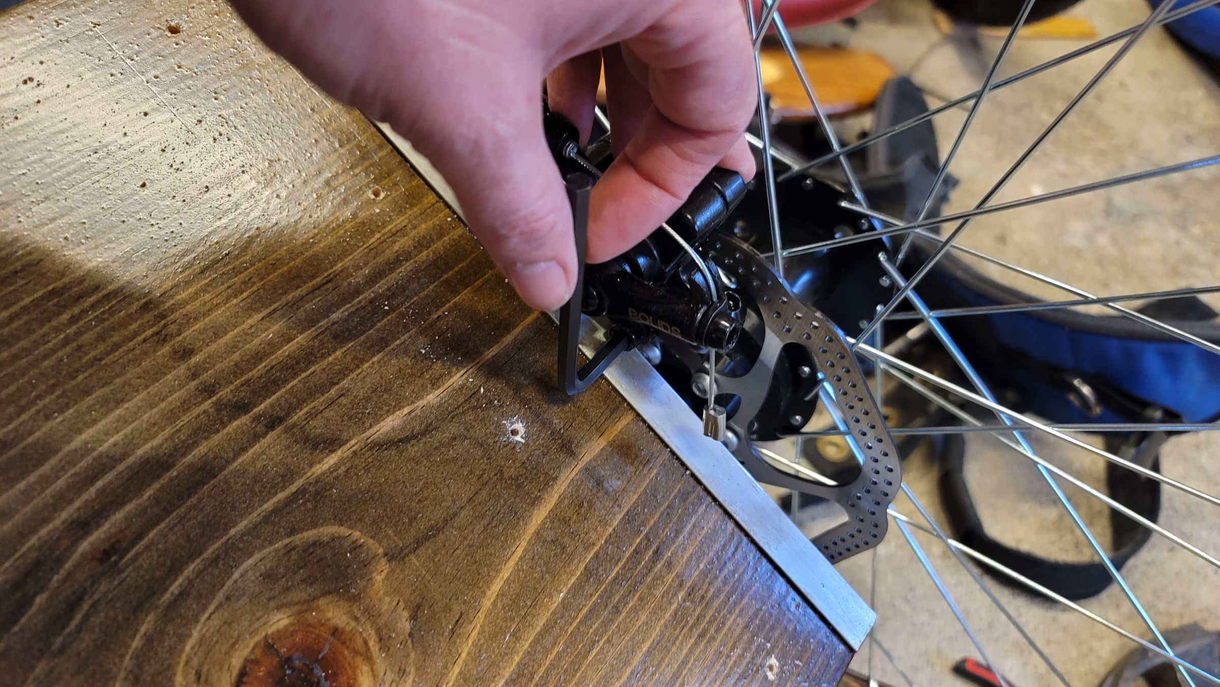 Brake caliper mounted to the wood base